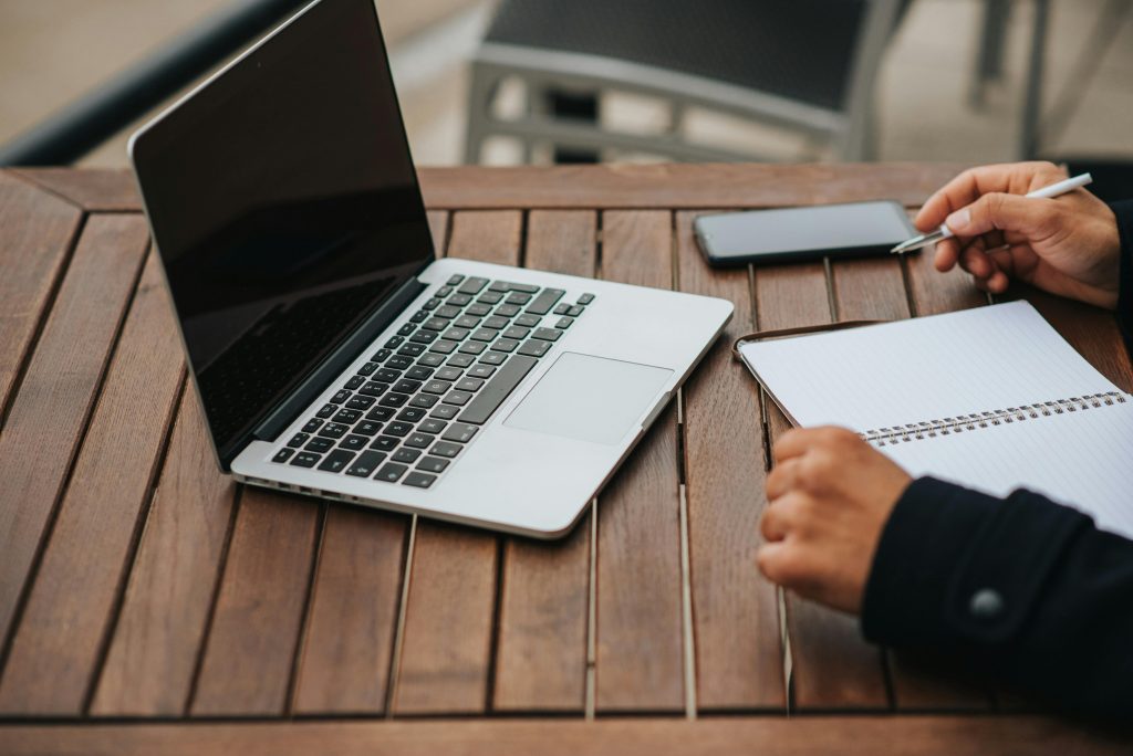 a person at a laptop writing a grant proposal